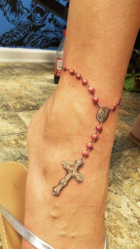 See more ideas about foot tattoos, rosary tattoo, tattoo bracelet. . Rosary on foot tattoo